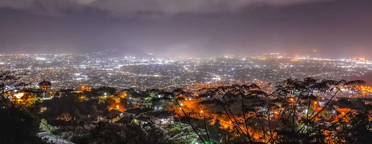 Kingston city lights at night seen from the hills above town